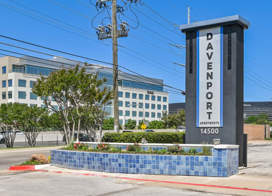 a sign that says davenport with a building in the background