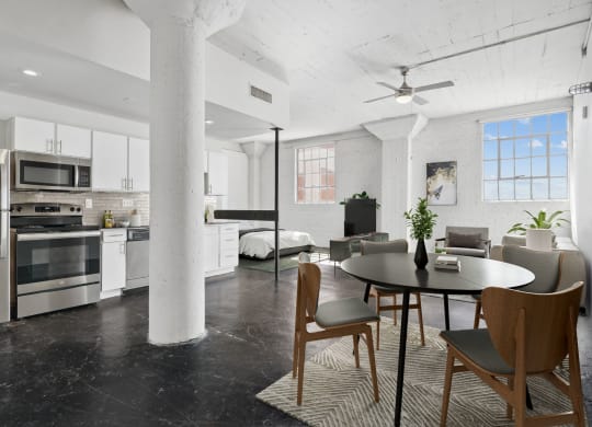 3200 Main Lofts kitchen and dining area, and bedroom and living space. Spacious studio loft in Dallas, TX.