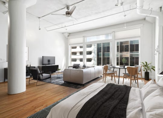 Mid Elm Lofts bedroom and living area with a large window