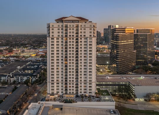 an aerial view of the Dominion Post Oak at dusk in Houston, TX