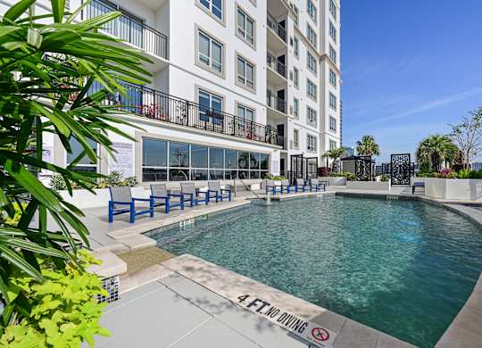 Our sparkling pool on the rooftop patio at Dominion Post Oak apartments in Houston, TX