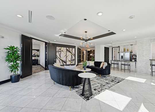 Spacious resident lounge with a black and white color scheme at Dominion Post Oak apartments in Houston, TX