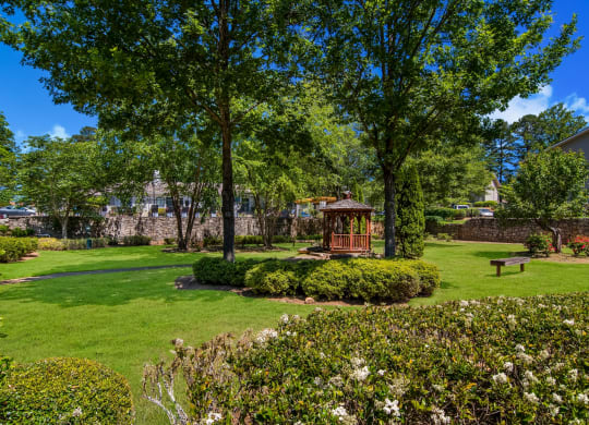 a grassland with a gazebo in the middle at Dunwoody Pointe in Sandy Springs, GA