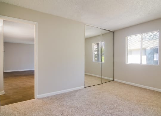 an empty bedroom with a window at Dunwoody Pointe in Sandy Springs, GA