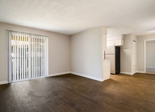 an empty living room with a large window at Dunwoody Pointe in Sandy Springs, GA