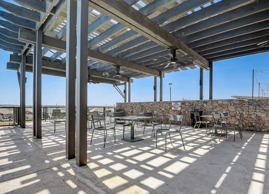 a seating area under a pergola on a sunny day at Beacon at Meridian, San Antonio, TX