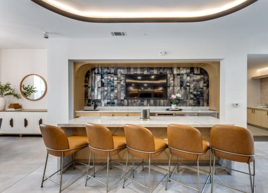Clubhouse kitchen with bar stools at Era Apartments in Denton, TX