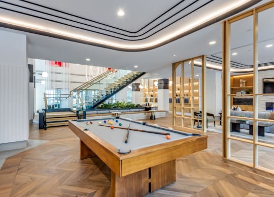 Clubhouse pool table in a lobby at Era Apartments in Denton, TX