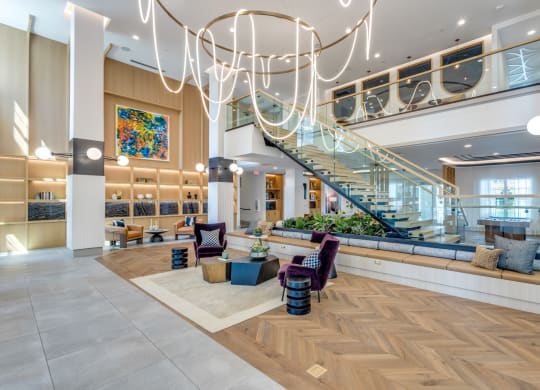 Lobby area with string light chandelier at Era Apartments in Denton, TX