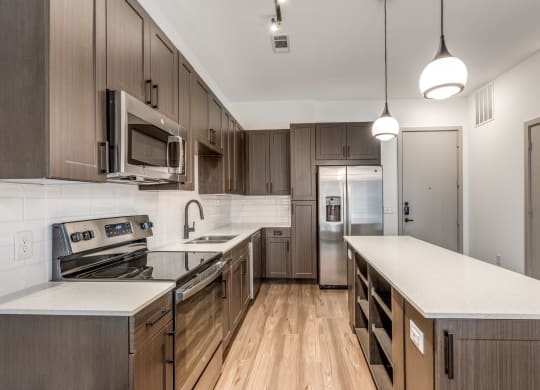 Modern Kitchen with Stainless Steel Appliances at Era Apartment in Denton, TX