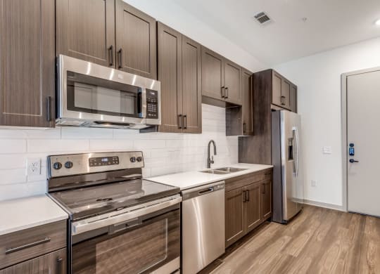 Spacious Kitchen with Contemporary Design at Era Apartment in Denton, TX