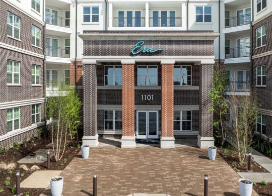 Exterior main entryway of Era apartments in Denton, TX
