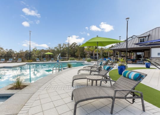 Poolside lounge chairs at Evergreen at Southwood in Tallahassee, FL