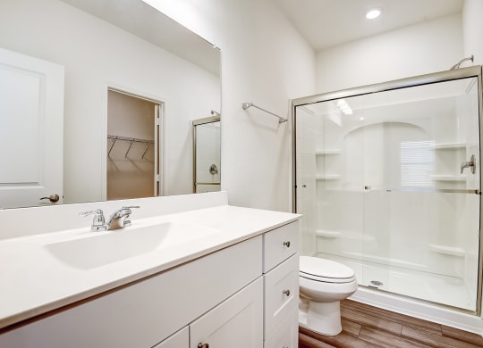 a bathroom with a toilet sink and shower at Beacon at Meridian, San Antonio, 78245