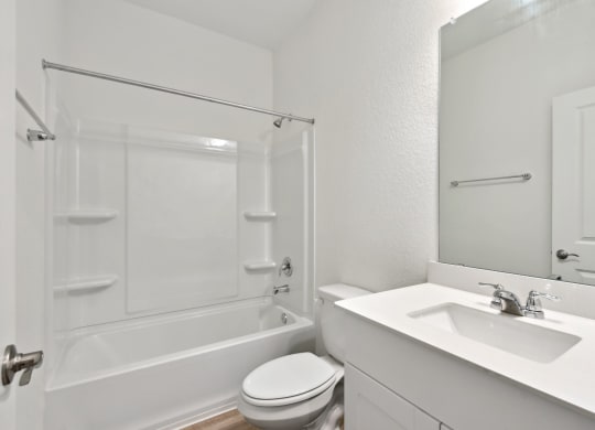 a bathroom with a sink toilet and bathtub
