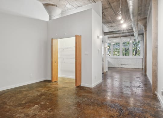 an empty room with a door in the middle of it