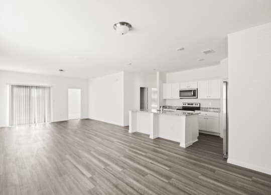 a black and white photo of a kitchen and living room at Beacon at Bunton Creek, Kyle, TX