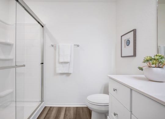 a bathroom with a toilet sink and shower at Beacon at Meridian, San Antonio, 78245