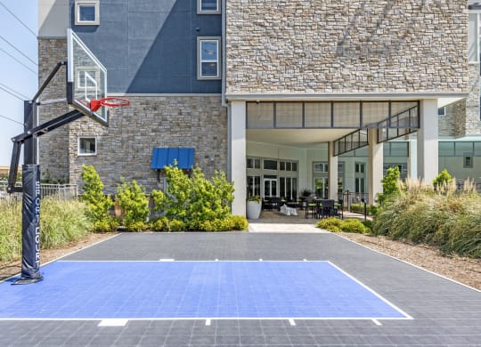 a basketball court in front of a building
