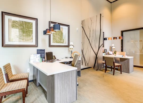 a conference room with a desk and chairs and a table