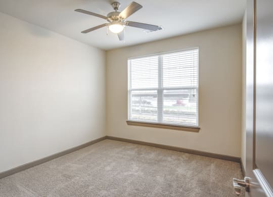 a room with a row of triangles on the wall and a window