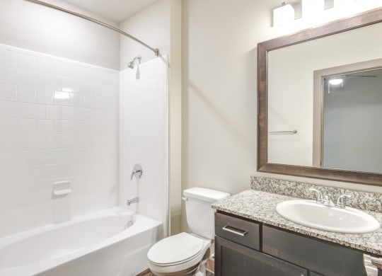 a bathroom with a sink toilet and a bath tub
