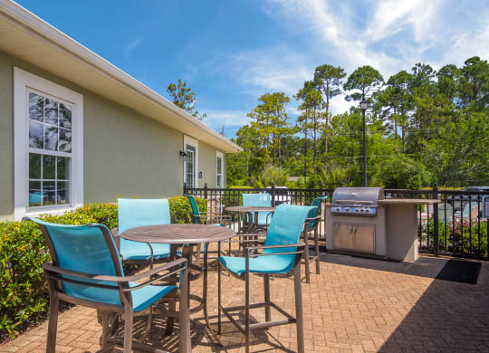 Outdoor grill area perfect for barbecues at Angel Landing apartments in Pensacola, FL