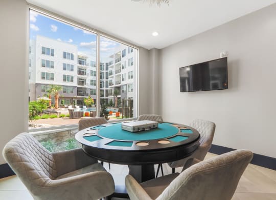 a poker table and chairs at Harlow River Oaks in Houston, TX