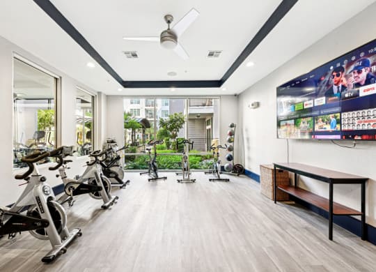 Spin cycle studio with immersive lighting and sound system at Harlow River Oaks apartments in Houston, TX