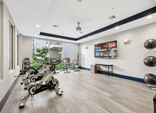 Professional-grade spin cycle studio with high-performance bikes at Harlow River Oaks apartments in Houston, TX.