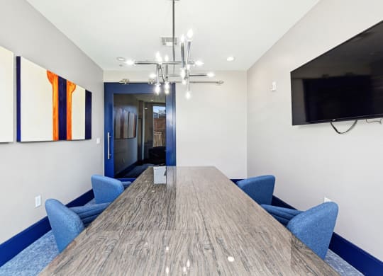 Professional conference room with a large table and chairs at Harlow River Oaks apartments in Houston, TX
