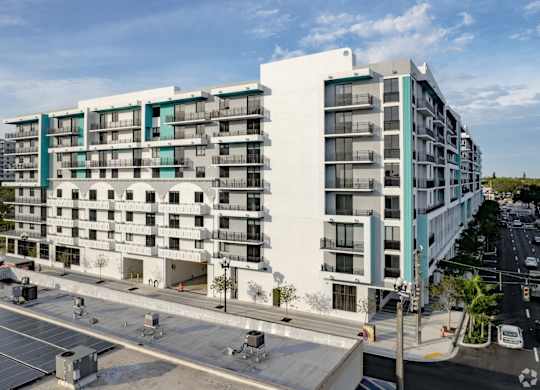 Rear view of the building with entry to our garage parking at Hollywood Heights on the Boulevard Luxury Apartments in Hollywood, FL