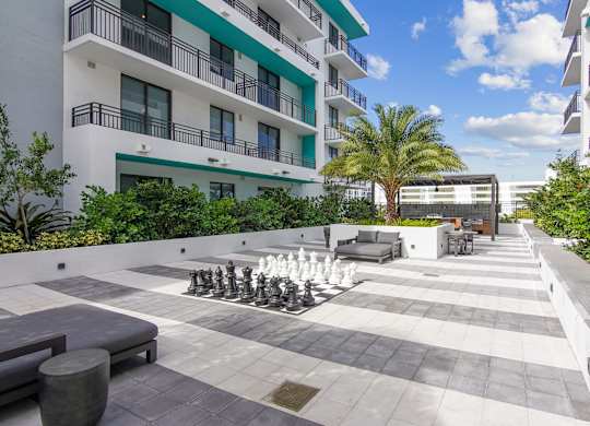 A giant chess set is set up on our courtyard at Hollywood Heights on the Boulevard Luxury Apartments in Hollywood, FL