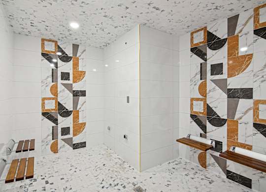 Steam room with tile geometric patterns on the wall at Hollywood Heights on the Boulevard Luxury Apartments in Hollywood FL