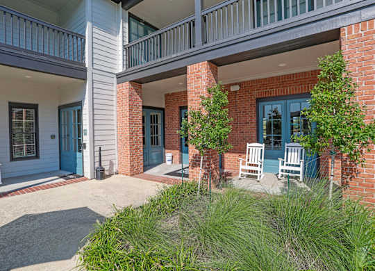 Entrance to leasing office with brick pillars at Ultris Island Park in Shreveport, LA