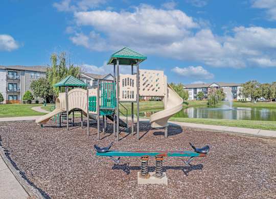 Onsite playground with a seesaw and a slide at Ultris Island Park in Shreveport, LA