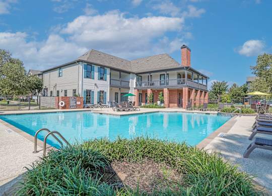 Pool behind the leasing office with poolside seating at Ultris Island Park in Shreveport, LA