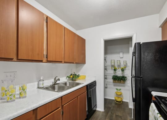 kitchen with wooden cabinets at Johnston Creek Crossing in Charlotte, NC