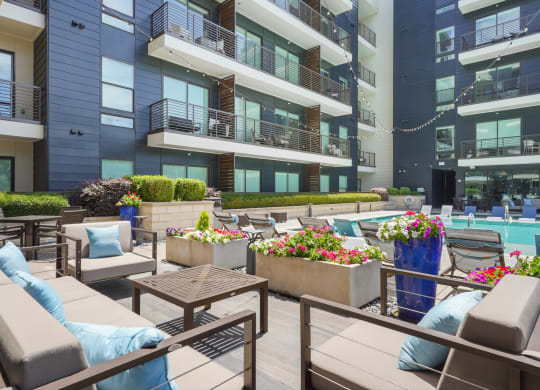 modern design poolside seating area at Knox Heights in Dallas, TX