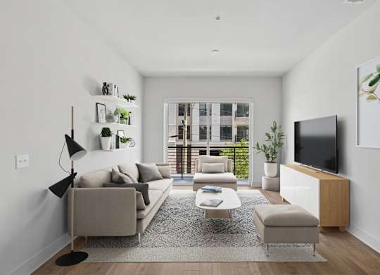 A virtually staged living room with a grey couch, a white coffee table, and a television on a wooden stand at Knox Heights apartments in Dallas, TX