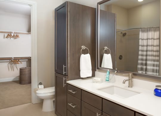 bright bathroom with a big mirror at Knox Heights in Dallas, TX