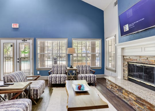 a living room with blue walls and a fireplace