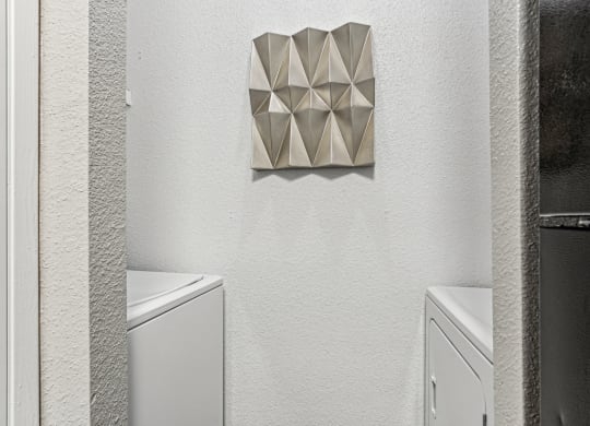 In-unit washer and dryer hookups at Laurels of Sendera apartments in Arlington, TX