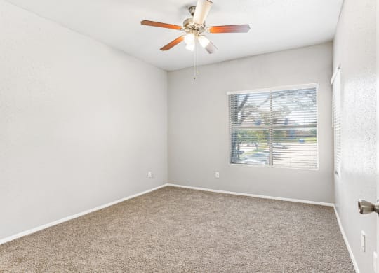 Quiet bedroom with large windows at Laurels of Sendera apartments in Arlington, TX