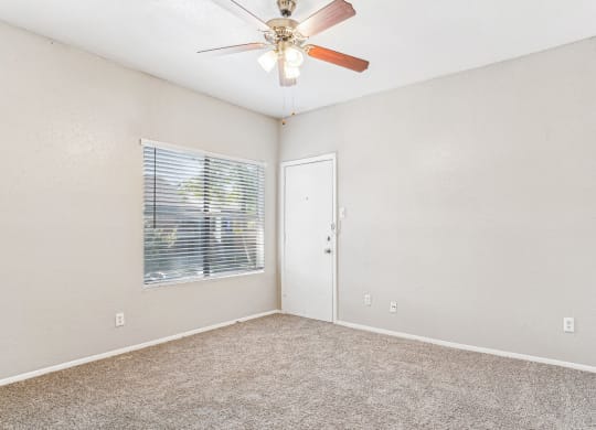 Large bedroom with carpet floor at Laurels of Sendera apartments in Arlington, TX