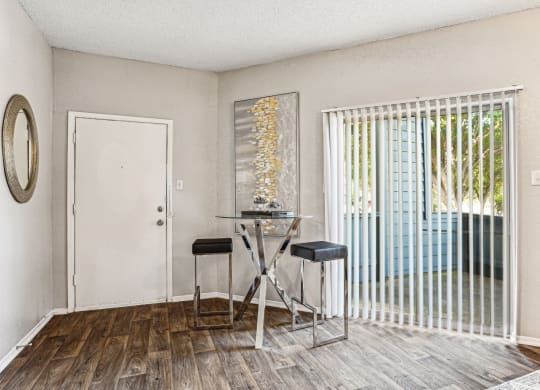 Sliding glass doors leading to a private patio at Laurels of Sendera apartments in Arlington, TX
