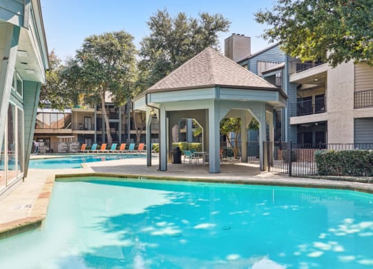 Inviting pool for sunbathing at Laurels of Sendera apartments in Arlington, TX