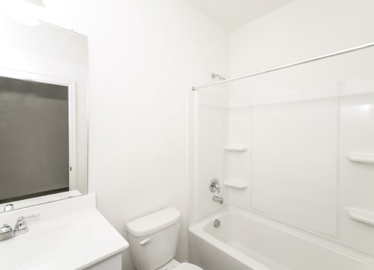 a bathroom with a bathtub and a sink at Beacon at Bunton Creek, Texas, 78640
