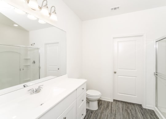 a bathroom with a toilet and a sink at Beacon at Meridian, San Antonio, TX 78245
