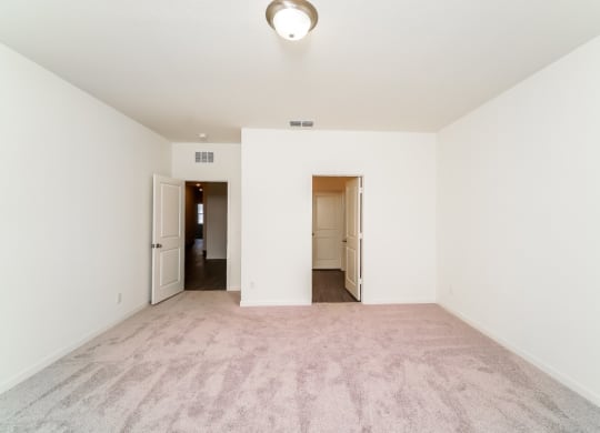 a bedroom with white walls and carpet at Beacon at Bunton Creek, Kyle, TX 78640